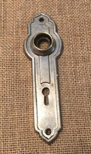 Load image into Gallery viewer, Antique Stamped Nickel Plated Brass Doorknob Plate - 1¾&quot; x 6&quot;
